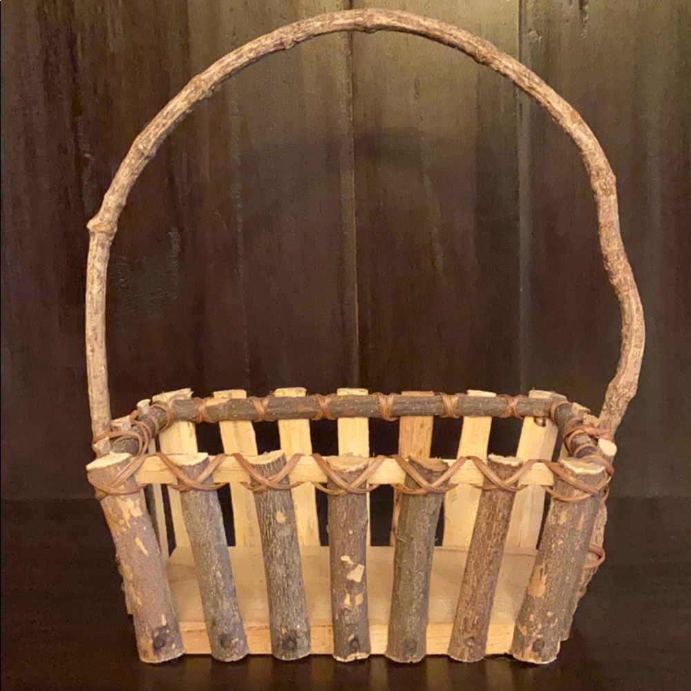 Rustic wood basket with bent twig handle